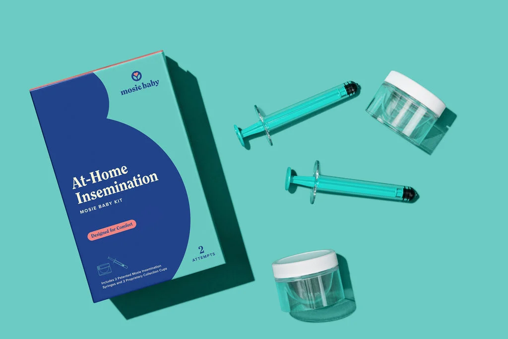 At-home insemination kit with syringes and collection cups on a teal background.