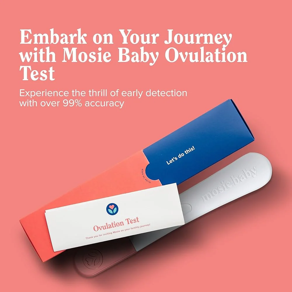 Mosie Baby ovulation test kit with packaging and instructions on a pink background.